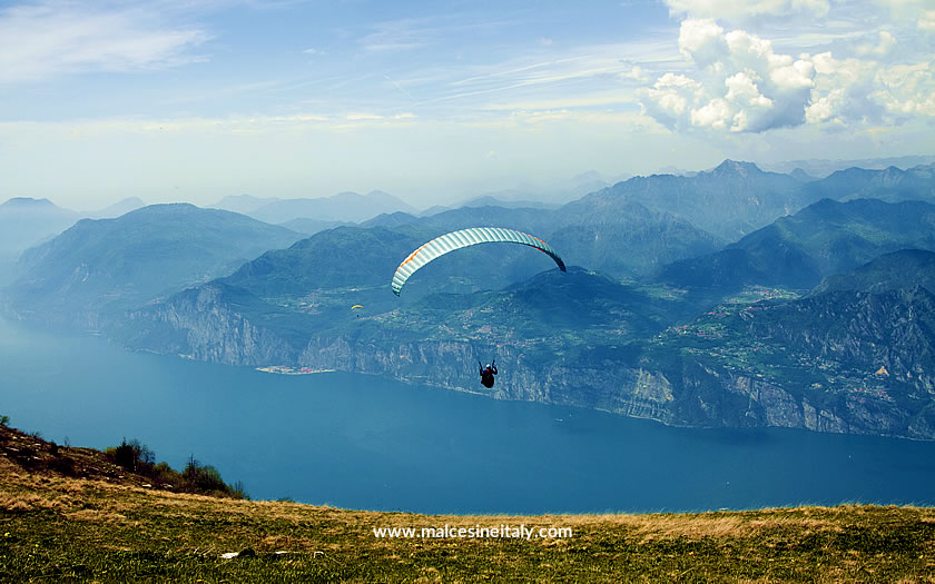 Paraglider taking off from Monte Baldo on Lake Garda